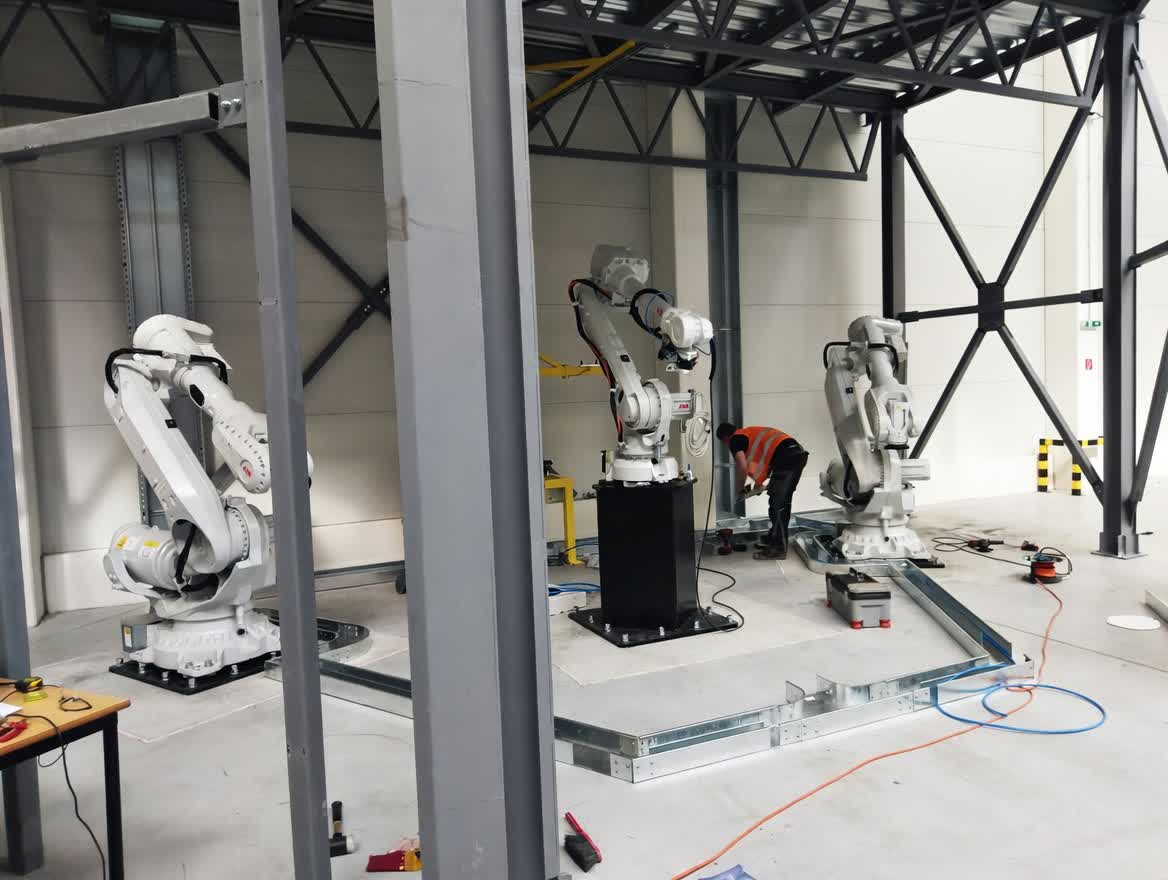 Industrial robotics cell during on-site installation and wiring phase