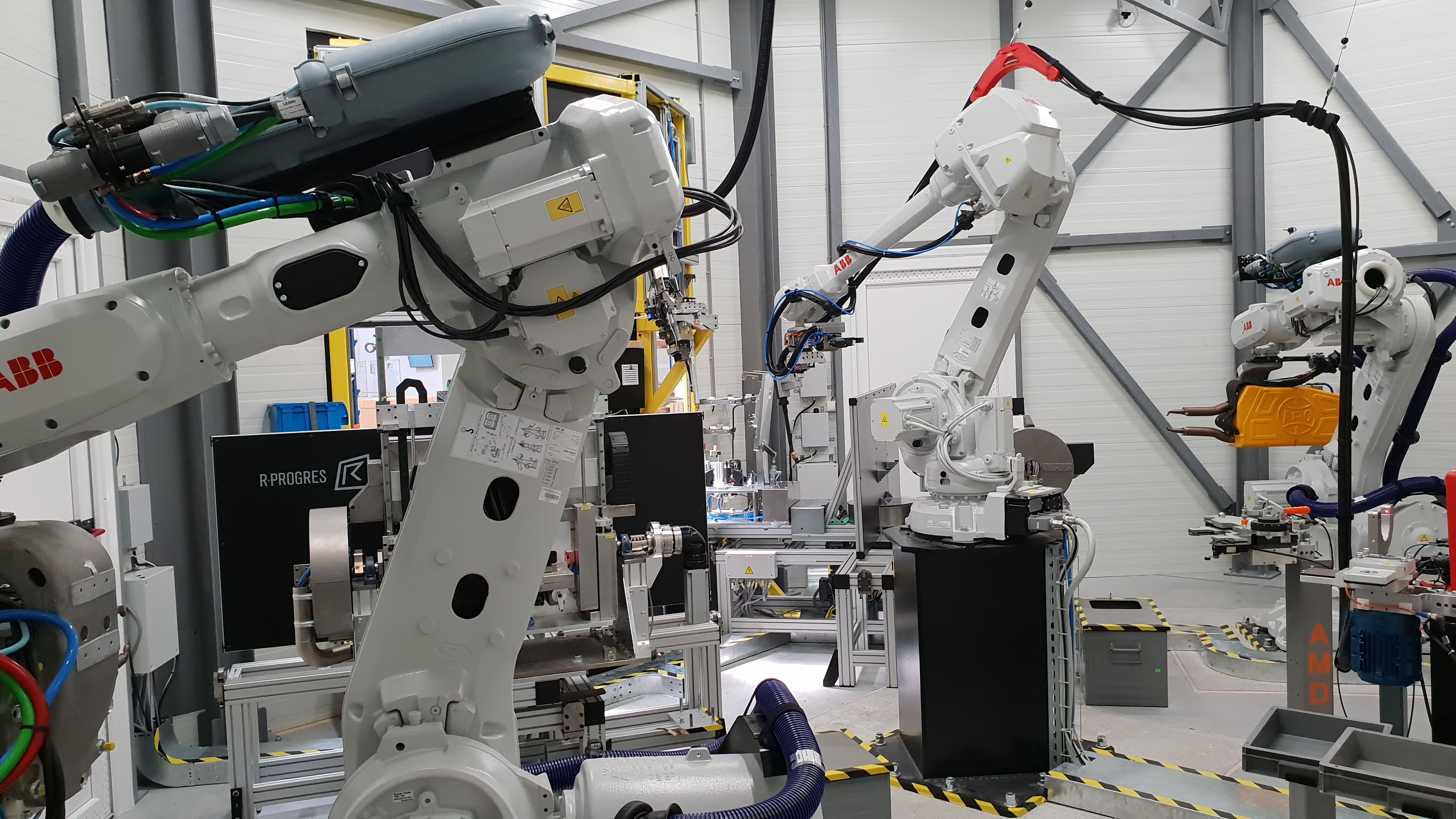Four-robot welding cell for stainless steel exhaust components using laser, arc, and spot welding with dual rotary positioners 2